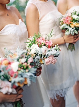 White Bridesmaids Dresses with Colorful Bouquets