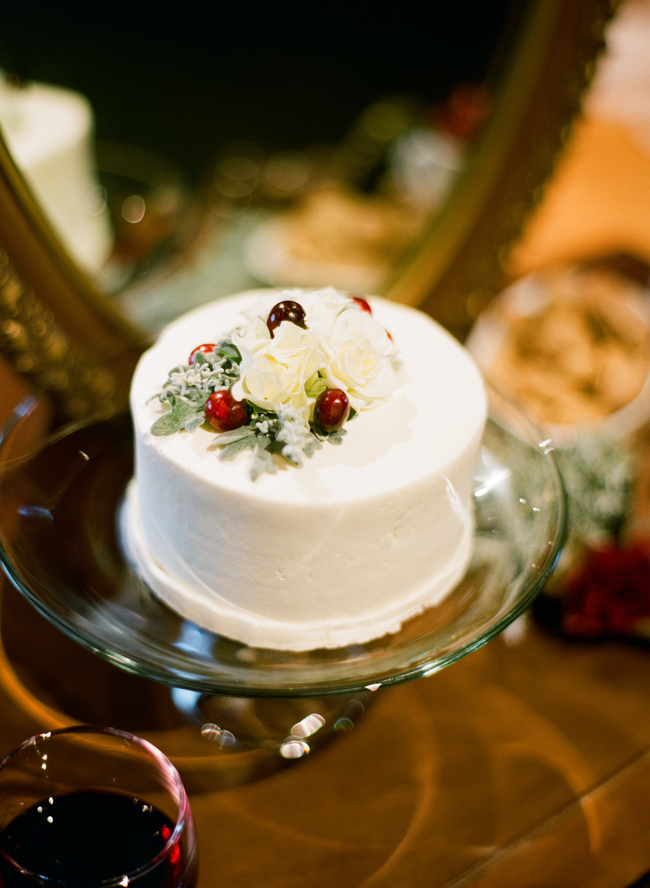 Mini Wedding Cake With Flowers and Red Berries