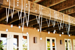 Votives Hanging on Ribbons From Ceiling Beam