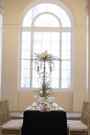 Candelabra Centerpiece With Flowers and Palm Fronds