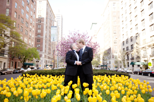 Couple Standing in Yellow Tulips