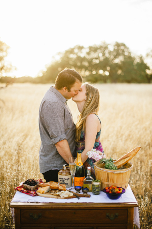 Couple With Picnic Spread in Field