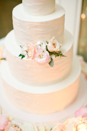 Wedding Cake With Brushed Buttercream and Flowers