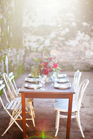 Outdoor Table and Chairs by Stone Wall