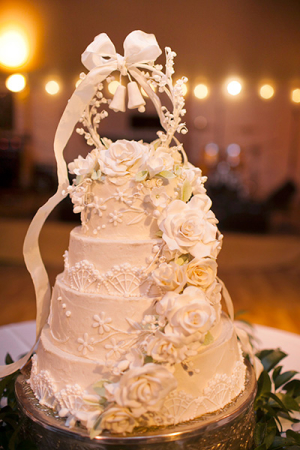 Wedding Cake With Sugar Flowers and Bell Topper