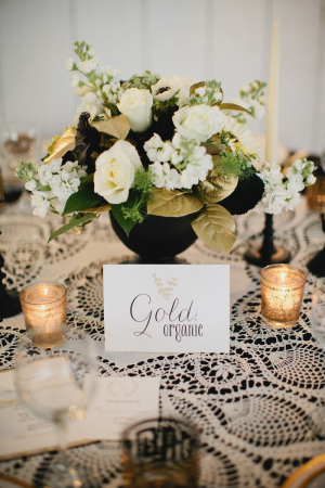 White and Gold Flowers in Black Vase