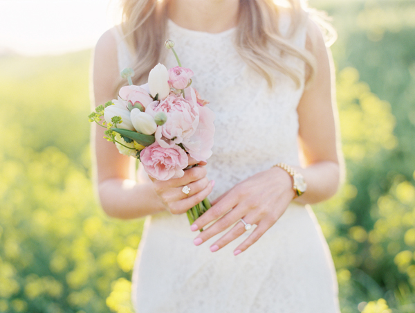 Bride in White Dress Holding Pastel Bouquet