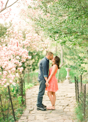 Couple Kissing Beneath Cherry Blossoms