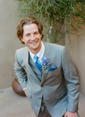 Groom in Gray Suit With Blue Tie and Hydrangea Boutonniere