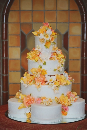 Wedding Cake With Yellow and Orange Flowers