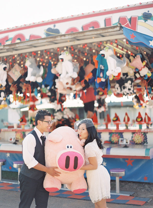 Couple Holding Giant Plush Pig