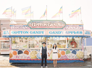 Couple Holding Hands at Cotton Candy Booth