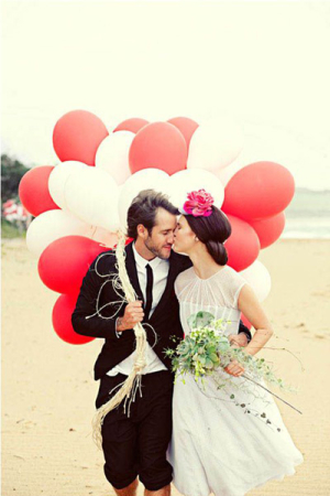 Couple on Beach with Balloons