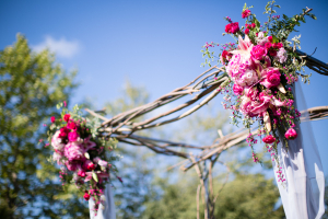 Rustic Branch Ceremony Altar With Pink Flowers