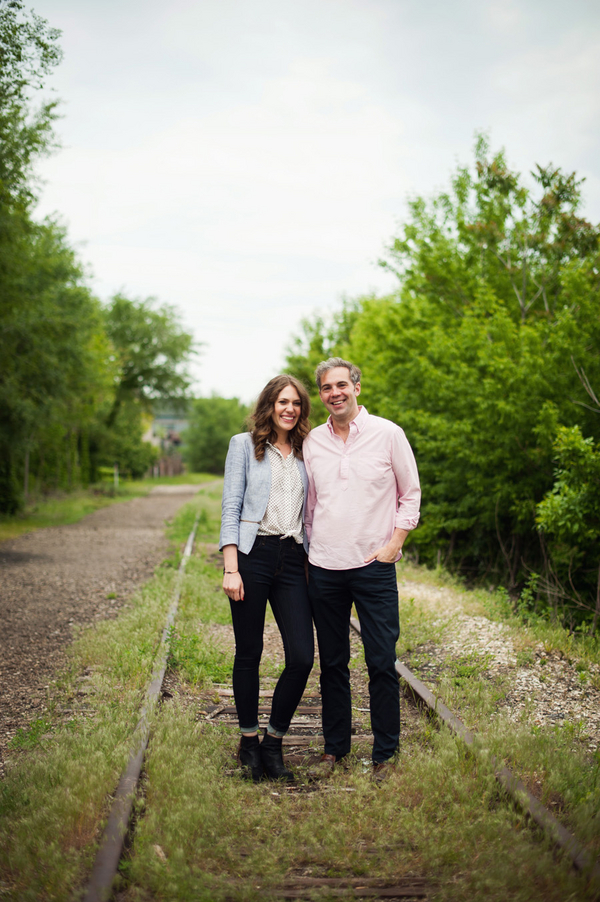 Engaged Couple on Railroad Tracks