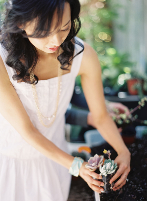 Girl in White Dress Potting Succulents