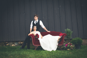Bride and Groom on Red Velvet Couch