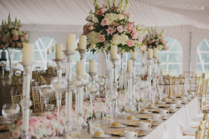 Cream and Pink Flowers and Candles on Reception Tables