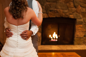 Bride and Groom Dancing Beside Fire