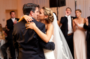 Bride and Groom Kissing During Dance