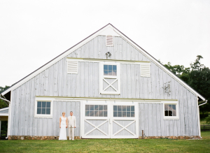 Bride and Groom in front of Barn