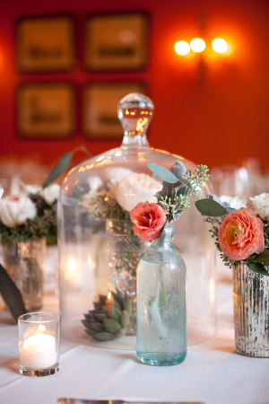 Glass Bottles and Flowers on Reception Tables
