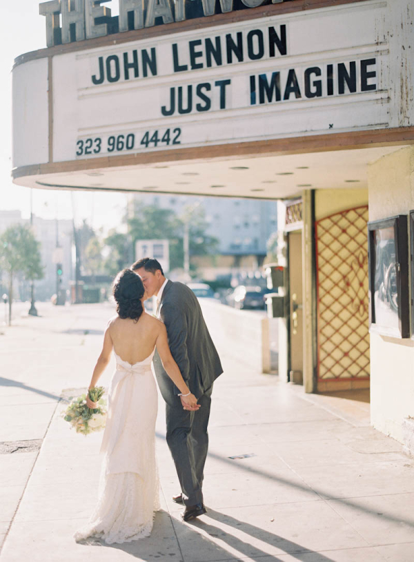 Bride and Groom Under Theatre Sign