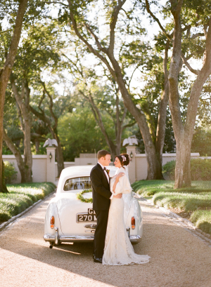 Bride and Groom with Vintage Getaway Car