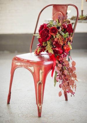 Rich Red Bouquet on Red Metal Chair