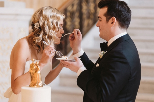 Bride and Groom Eating Cake