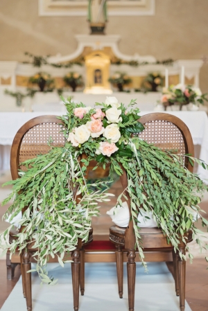 Floral Garland on Church Chairs Italian Wedding