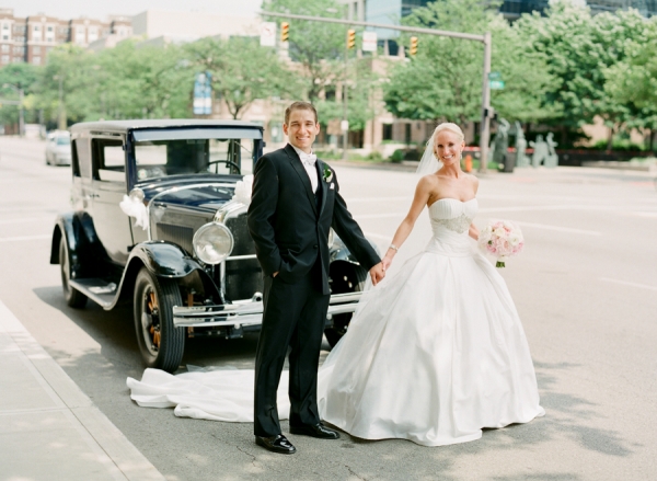 Bride and Groom Beside Vintage Car