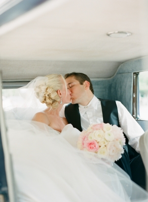 Bride and Groom in Antique Getaway Car