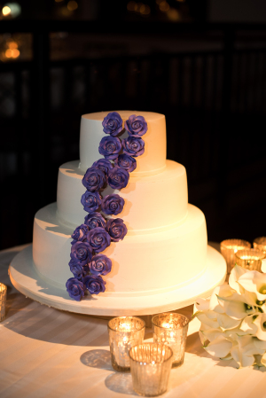 Wedding Cake with Purple Icing Flowers
