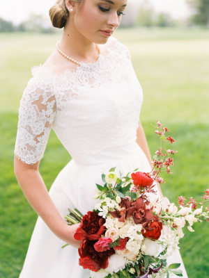 Bride with Bouquet in Shades of Red