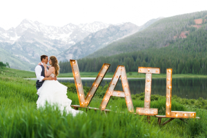 Bride and Groom by Vail Sign