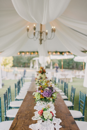 Tent Wedding Reception with Purple Flowers