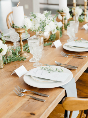 Green and Gold Centerpiece on Wood Table