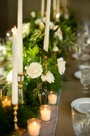 Centerpiece of Candles and Greenery
