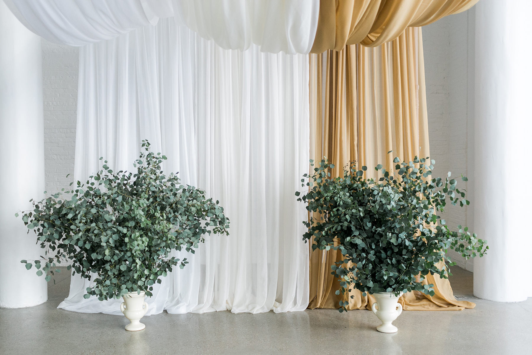 Enormous Greenery Urns for Wedding Altar