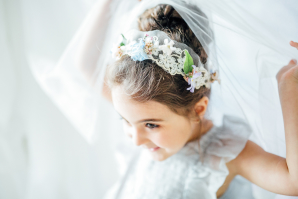 Flower Girl Playing with Wedding Dress