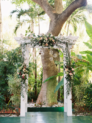 Flowers on White Wedding Arch