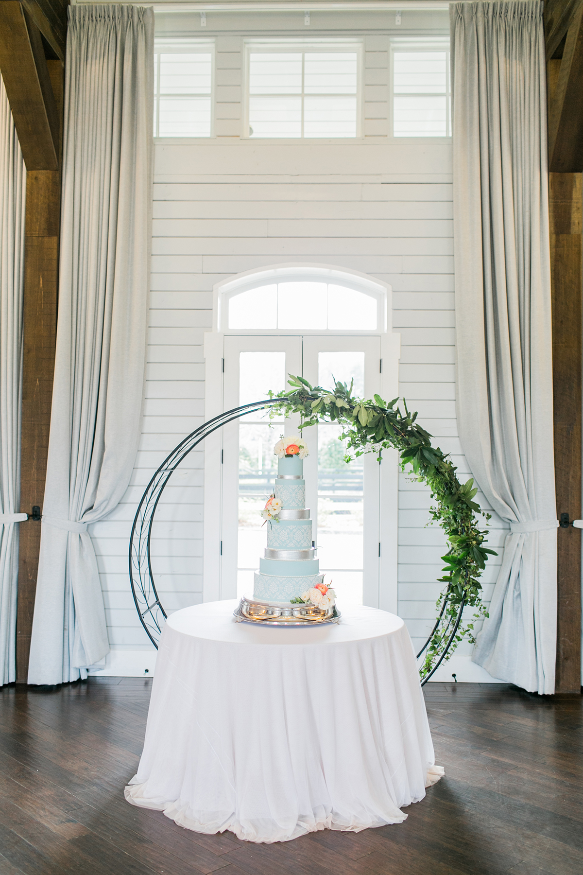 Wedding Cake with Greenery Backdrop