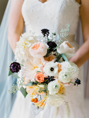 Bride with Apricot and Burgundy Bouquet