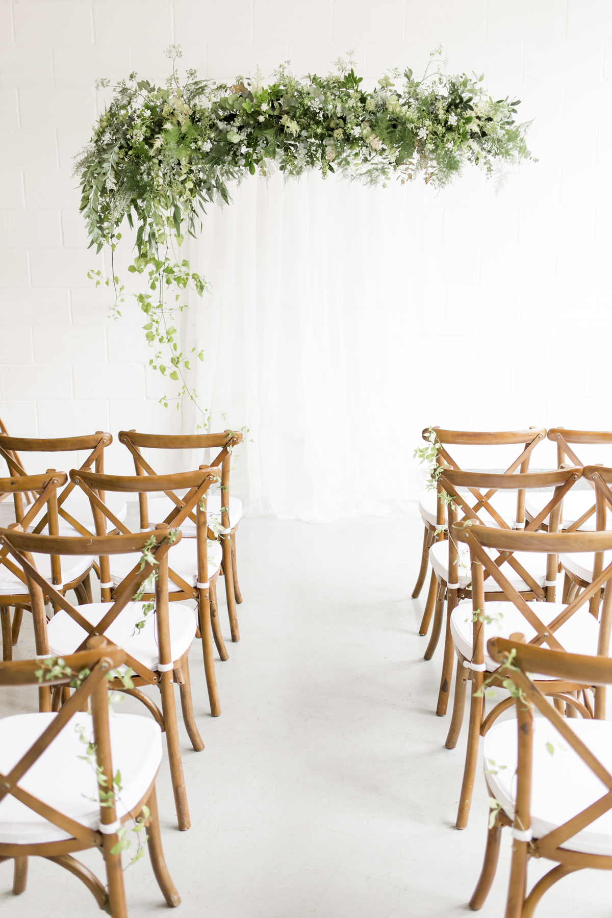 Wedding Ceremony Backdrop with Hanging Greenery