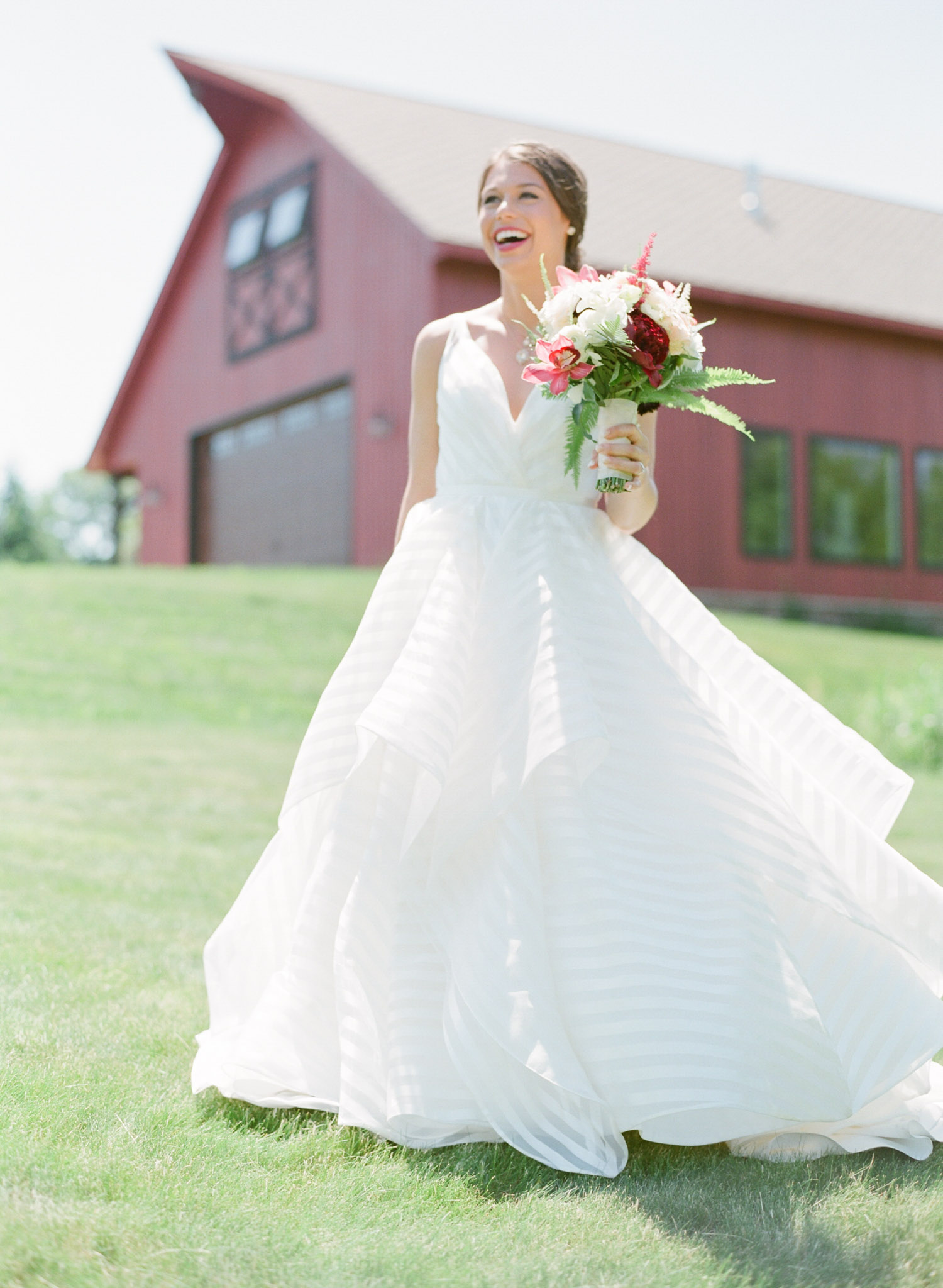 Bride in front of Barn