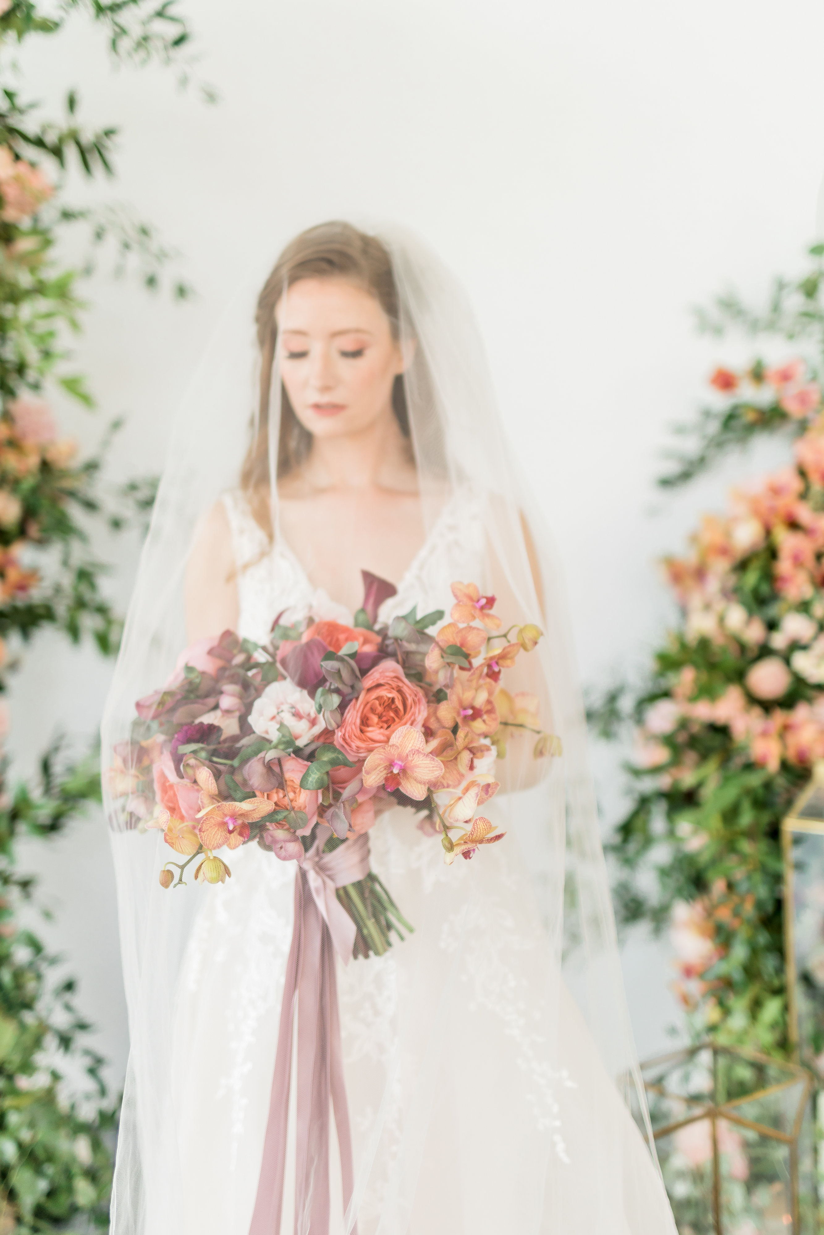 Bride with Coral and Mauve Bouquet